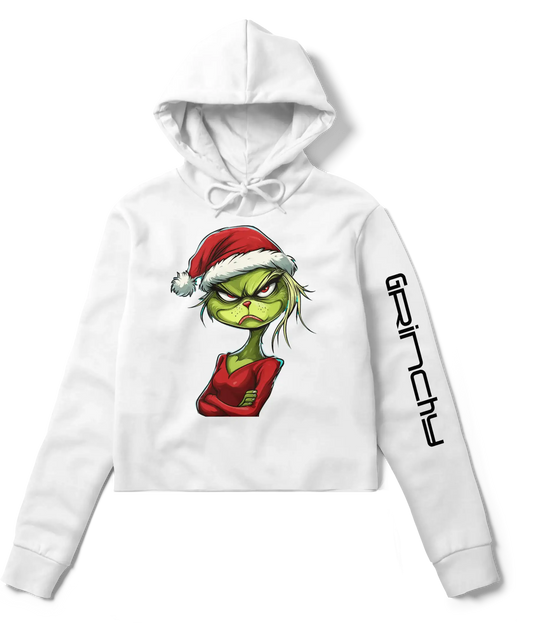 White cropped hoodie featuring a sassy Grinch design in a Santa hat and red outfit on the front, with ‘Grinchy’ text printed on the sleeve.