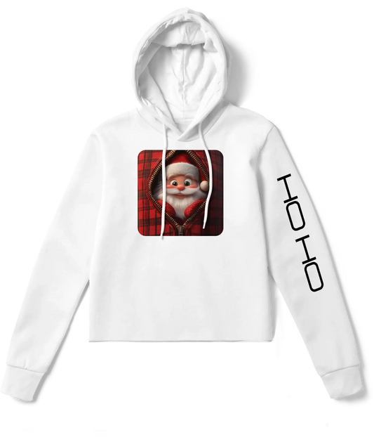 White cropped hoodie featuring a playful Santa Claus design framed by a red plaid zipper pattern, with ‘HO HO’ text printed on the sleeve.