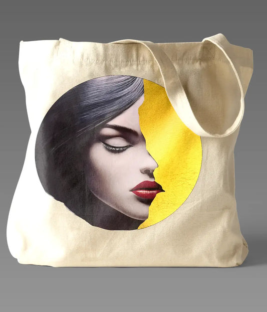 Radiant Grace Tote bag featuring an artistic portrait of a woman with black hair and red lips against a golden circular background, symbolizing beauty and empowerment.