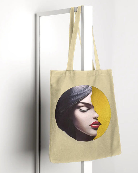 Radiant Grace Tote bag - Big Mood Tote Bag- portrait of a woman with black hair and red lips against a golden circular background, symbolizing beauty and empowerment.