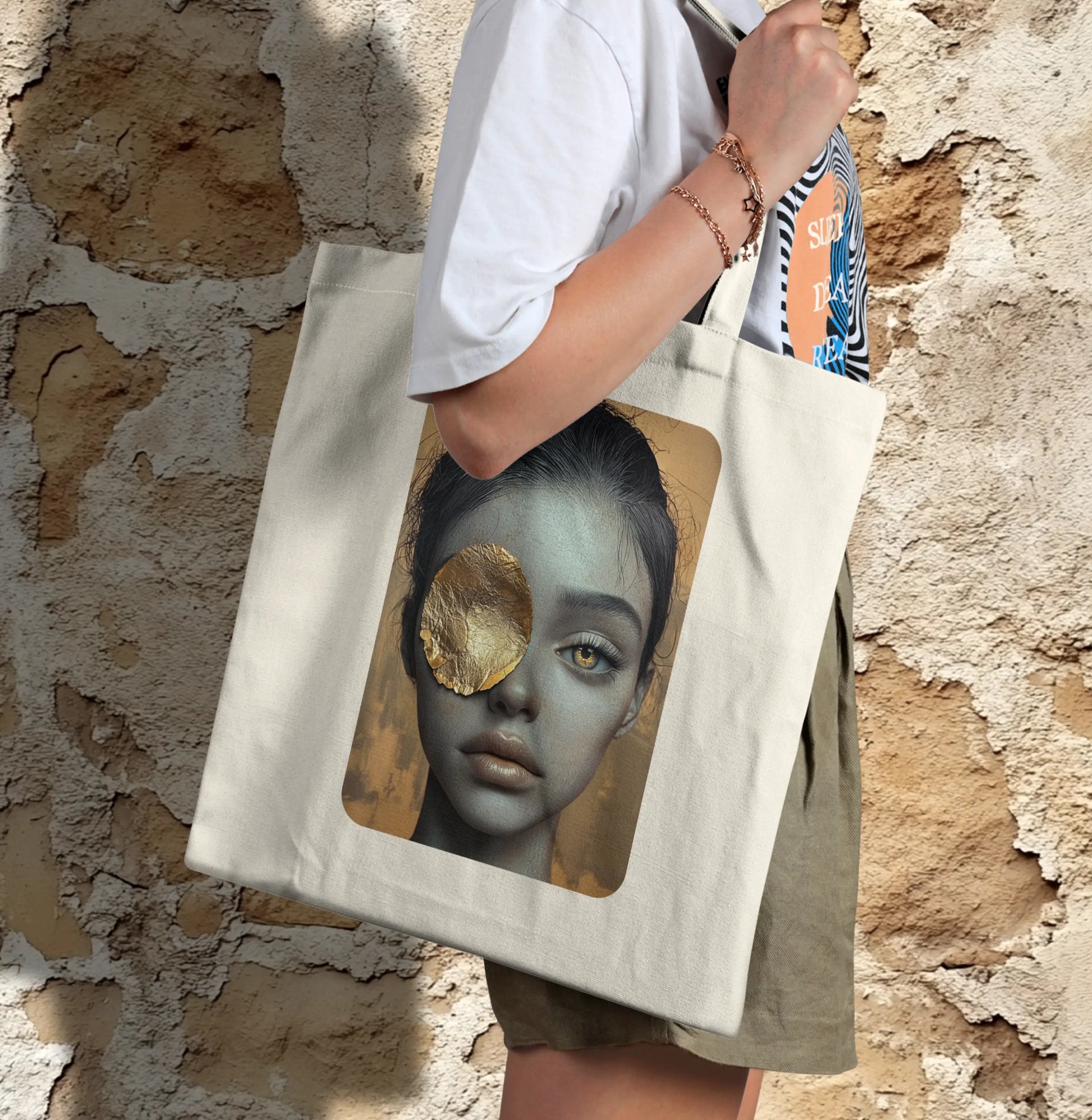 Golden Gaze Tote bag featuring an artistic design of a woman’s face with a captivating golden eye patch, symbolizing bold and expressive art.